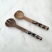 Crafted from durable black palm wood, these salad servers feature a thick handle for a comfortable grip and bold contrast to enhance your dining experience. Perfect for serving or as a unique gift for any occasion. Elevate your dining table with these stylish and functional servers.